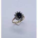 A 9ct gold diamond and sapphire cluster ring