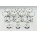 A set of 11 Babycham glasses