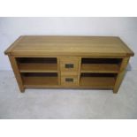 A modern oak sideboard with two central drawers