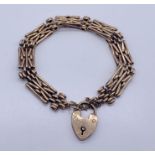A 9ct gold gate bracelet with padlock, weight 15.9g