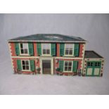A vintage Met Toy tin plate dolls house with garage