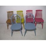 Two Ercol dining chairs (both painted blue), along with four Ercol style stick-back chairs (three