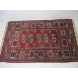 An eastern red ground rug