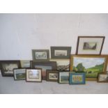 A collection of various pictures, frames etc.