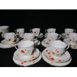 A Colclough bone china poppy tea set, comprising ten trios, ten bowls, two jugs