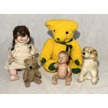 A collection of vintage teddies and dolls