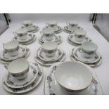 A Court China part tea set including ten trios, two plates and one bowl.