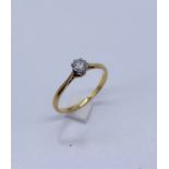 A diamond solitaire ring set in 18ct gold