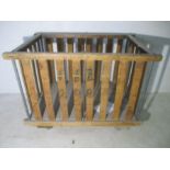 A slatted wooden industrial bobbin trolley