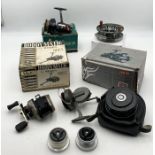 A collection of fishing reels including Zero360 Freerunner Wheel, Roddymatic 699L, Intrepid Rimfly