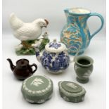 A collection of china including a Beswick jug showing rabbits, Sadler teapot, pottery chicken,