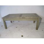 A teak, garden coffee table. 61cm x 120cm, height 45cm