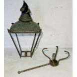 An antique copper street lantern frame along with bracket
