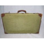 A vintage suitcase, marked on inside with F.Ltd 1944