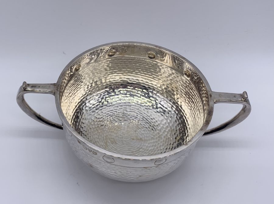 A cased Arts & Crafts hallmarked silver two handled bowl and matching spoon, hallmarked for Barker - Image 4 of 5