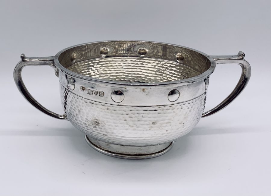 A cased Arts & Crafts hallmarked silver two handled bowl and matching spoon, hallmarked for Barker - Image 3 of 5