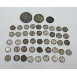 A small collection of silver coinage including an 1890 Victorian crown, a 1826 George IV sixpence