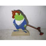 A "Toad" from Wind in the Willows, a one sided shop display stand, height 67cm. Plus a hobby horse.
