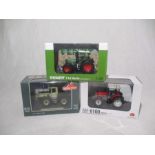 A collection of three boxed die-cast tractors (1:32 scale) including a Massey Ferguson 6100