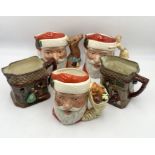 A collection of three large Royal Doulton Santa Claus character jugs including reindeer handle (D.