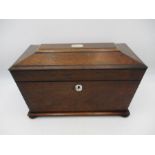 A 19th century Rosewood tea caddy with twin canister interior