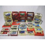 A collection of boxed die-cast vehicles including Matchbox Models of Yesteryear, Lledo Days Gone