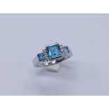 A contemporary topaz and diamond ring set in 9ct white gold