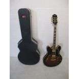 A Gibson Epiphone "Sheraton" Guitar, made in Korea (serial number S020403226), in Gator case