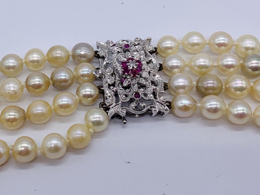 A four strand pearl necklace with an 18ct white gold clasp set with a diamond and rubies - Image 2 of 3
