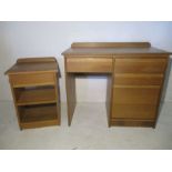 A light oak desk plus one cabinet.