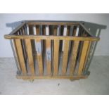 A slatted wooden industrial bobbin trolley