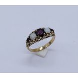 A Victorian 9ct gold garnet and opal five stone ring