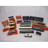 A collection of OO gauge model railways items including two Tri-ang electric locomotives, coaches,