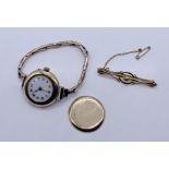 A Victorian 9ct gold brooch along with a 9ct ladies Victorian gold watch (hinge A/F, strap rolled