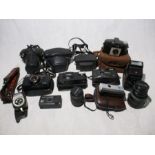 A quantity of various cameras, lens and accessories including Kodak, Pentax, Praktica, Canon,