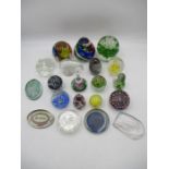 A collection of glass paperweights