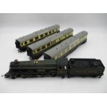 A unboxed Airfix OO gauge Caerphilly Castle (4073) locomotive with tender, along with three