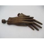 A pair of antique wooden sectional glove moulds/models- both A/F