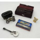 A small assortment of items including mother of pearl opera glasses, boxed Hohner Echo harmonica,