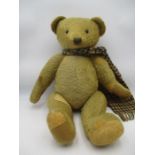 A large teddy bear with jointed limbs- some repairs, approx 60cm height