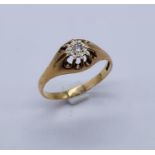 A large sized 9ct gold ring set with a solitaire diamond, weight 3.1g