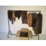 A collection of vintage coats and jackets including stole's, fur and faux fur.