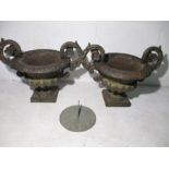 A pair of cast iron urn planters, plus a sun dial.