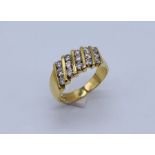 An 18ct gold dress ring set with 5 rows of diamonds