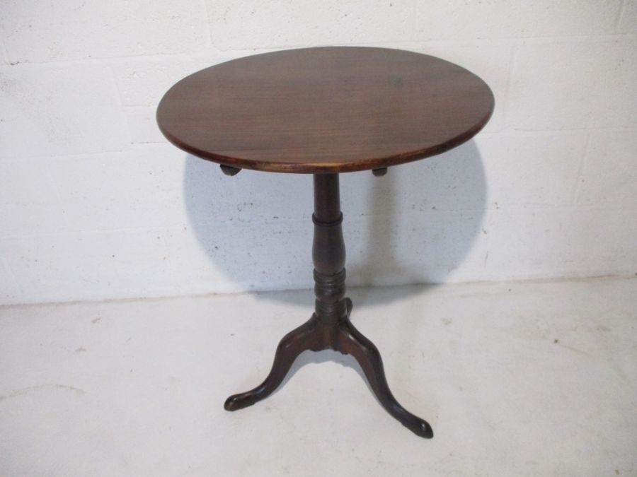 A Georgian mahogany occasional tip up table on tripod base.