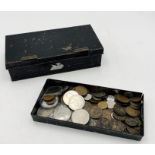 A vintage cash box containing a small quantity of crowns and coinage