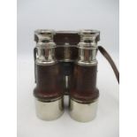 A pair of Naval/ Military binoculars in leather case