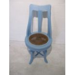 A blue painted swivel chair, numbered plate to top (No 75)