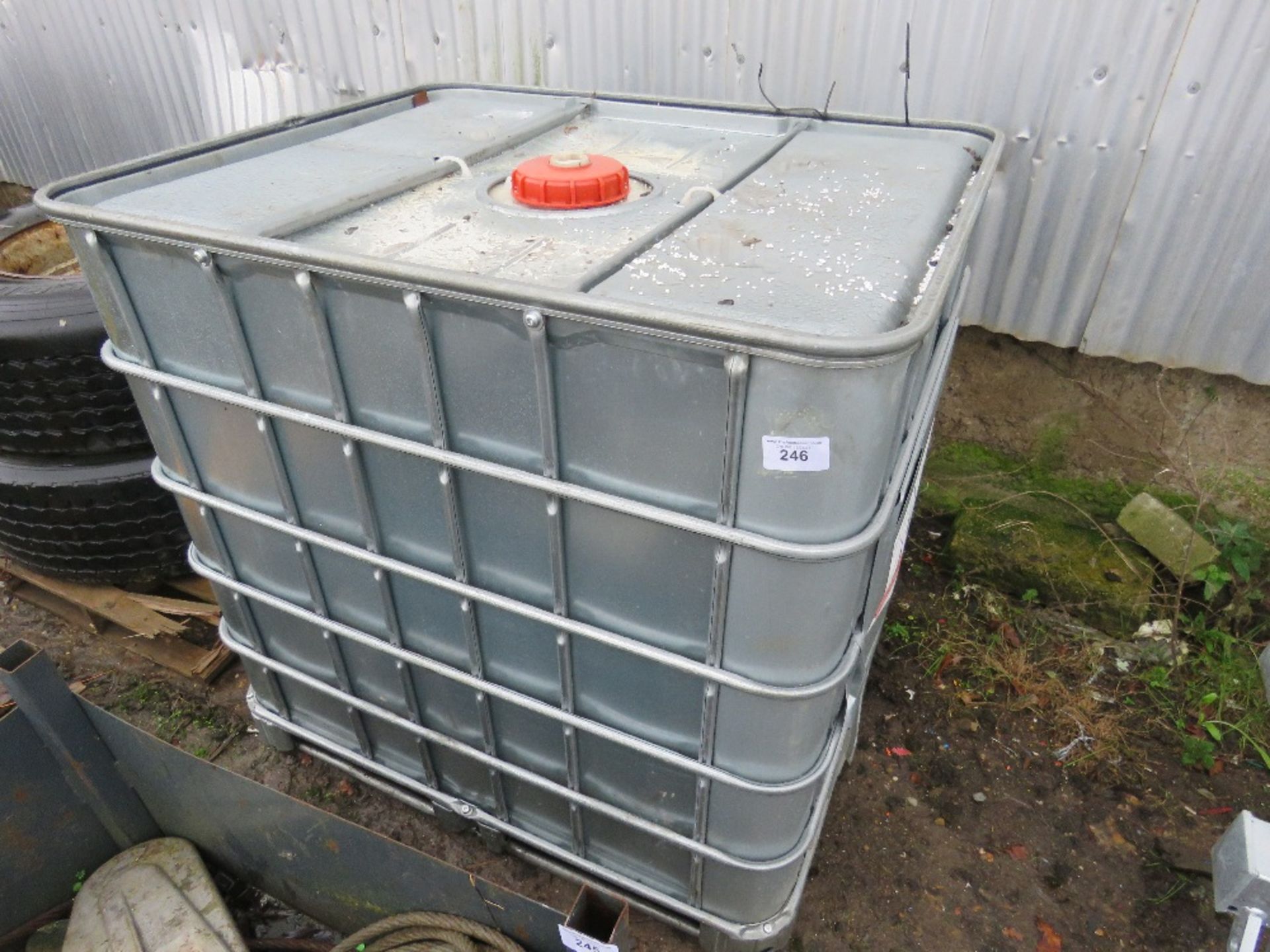 IBC CONTAINER WITH CONTENTS OF HYDRAULIC OIL. APPROX HALF FULL.