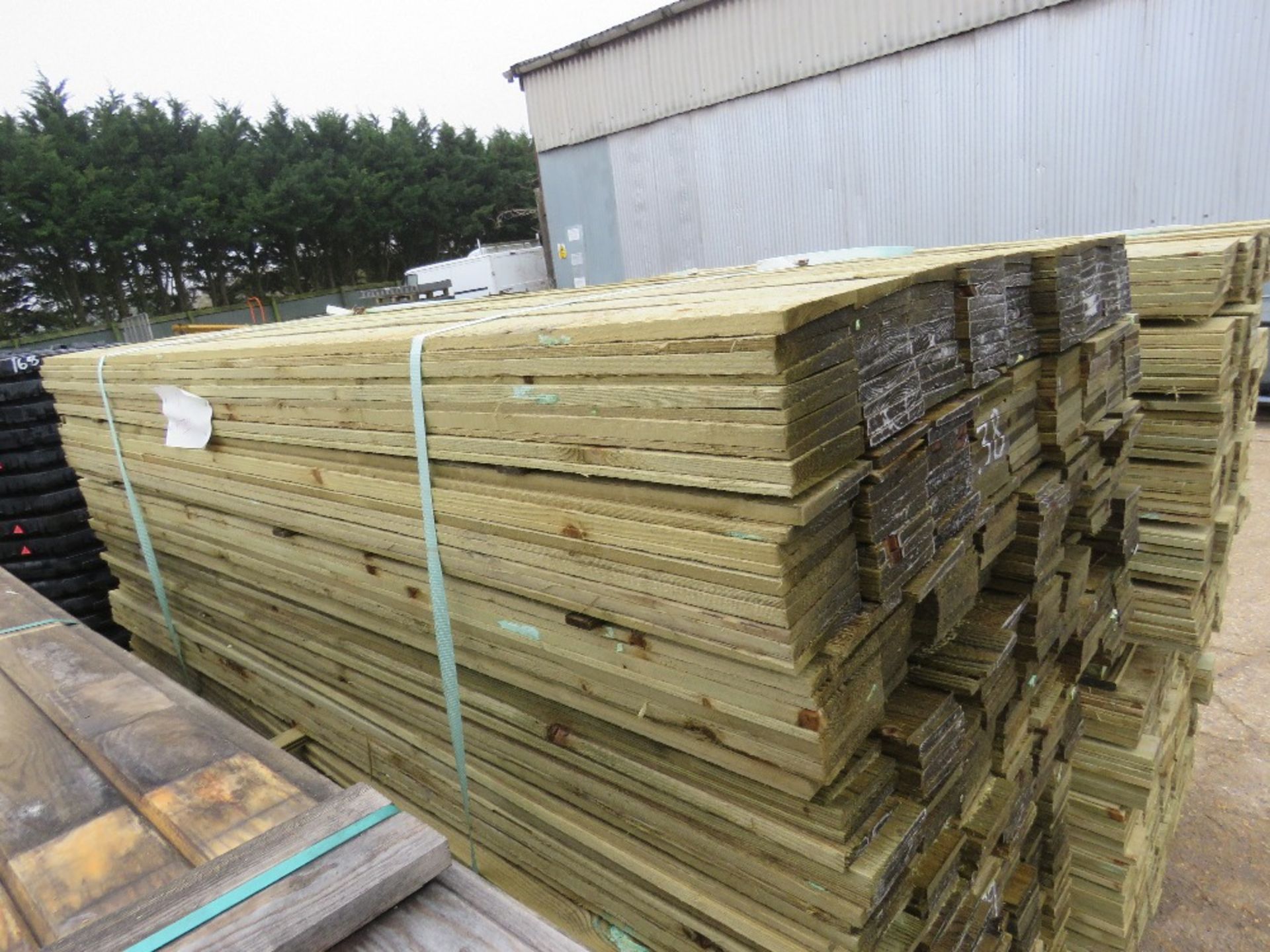 LARGE PACK OF TREATED FEATHER EDGE FENCE CLADDING TIMBERS 1.8M X 10CM APPROX. - Image 2 of 3